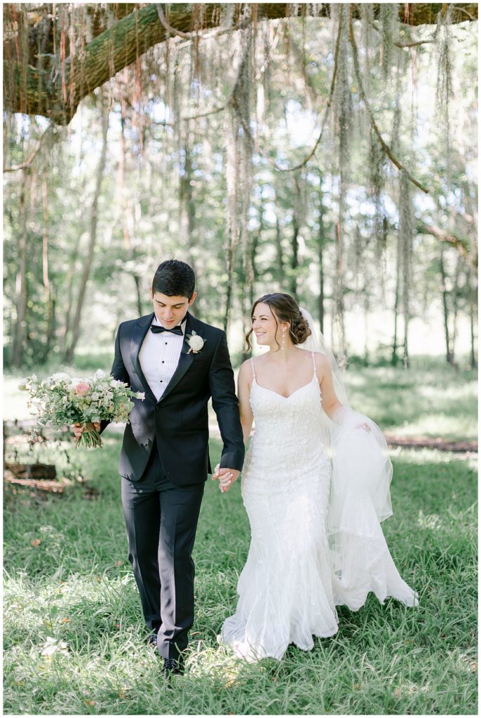 A groom walking with his bride. 