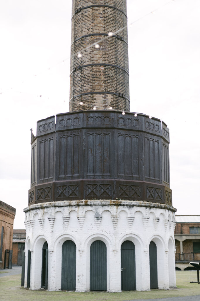 A white and brown smoke stack from a railroad museum.
