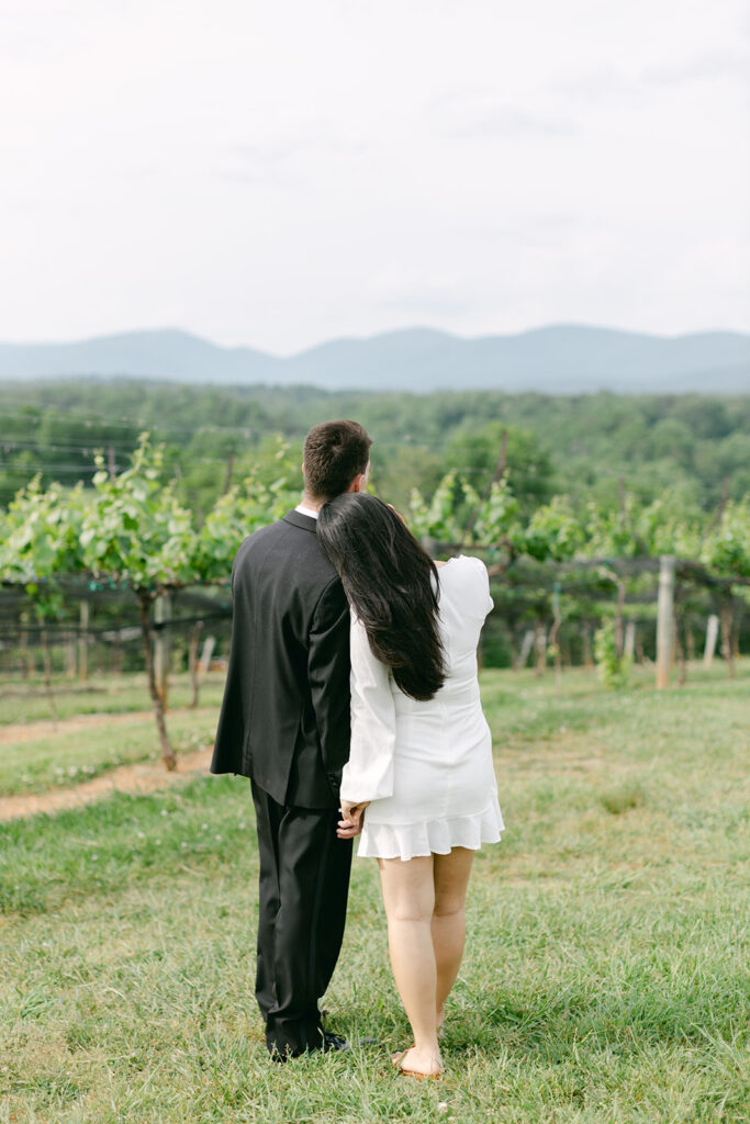 Couple staring out over expanse of Kaya Vineyard & Winery