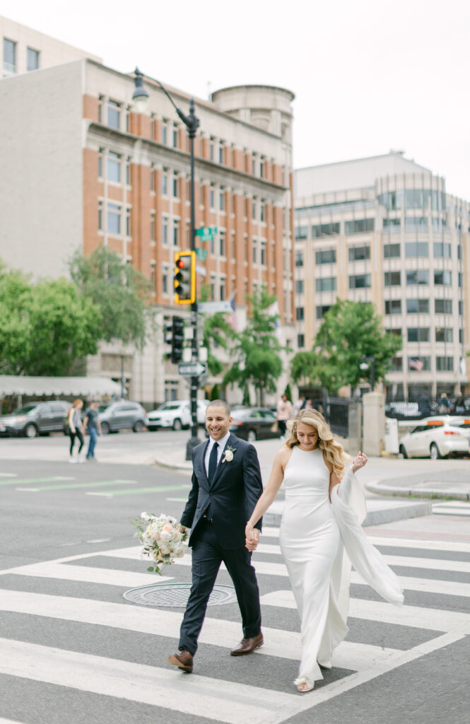 Bride and groom cross the street in Downtown DC.