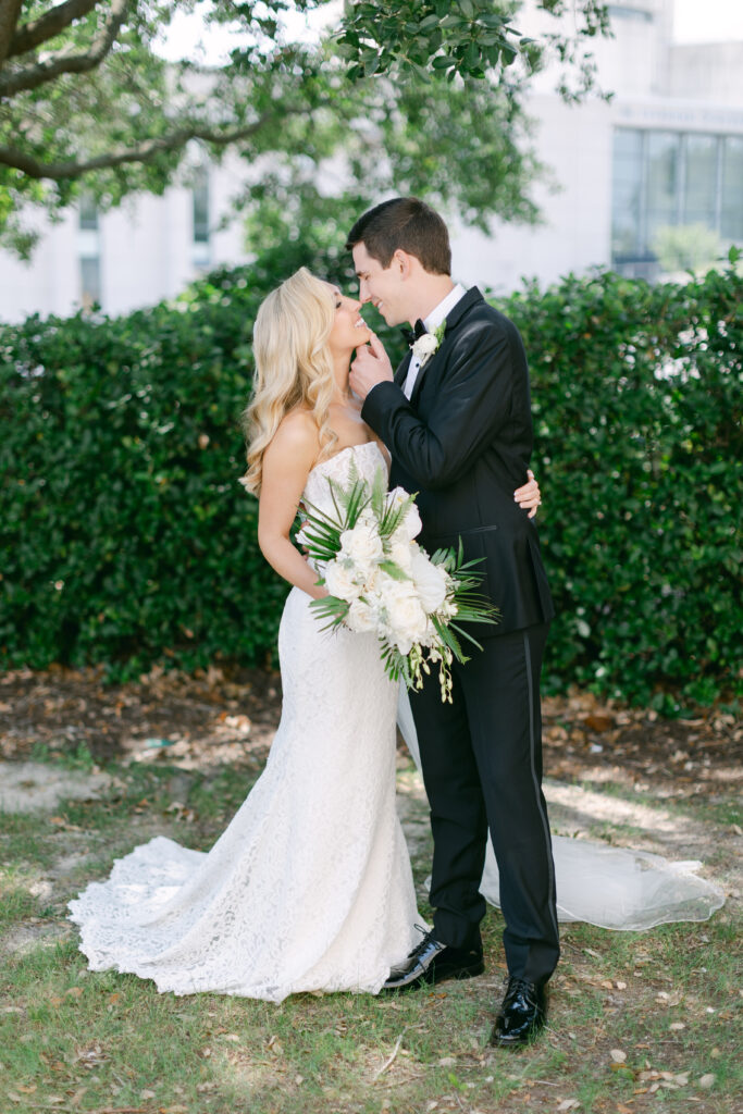 A bride and groom kissing. 