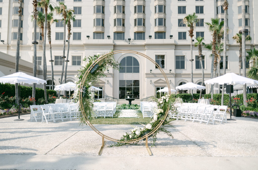 A ceremony space with flower petals and a circular alter. 