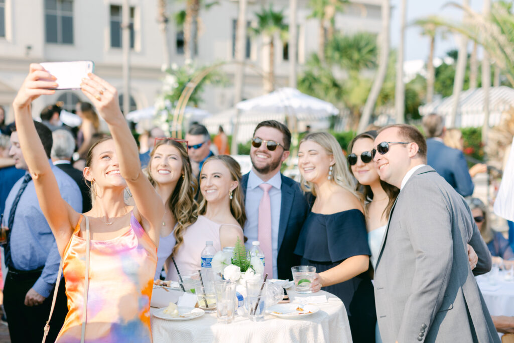 Guests take a group selfie at cocktail hour. 