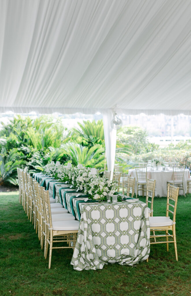 A table setting at a tent reception. 