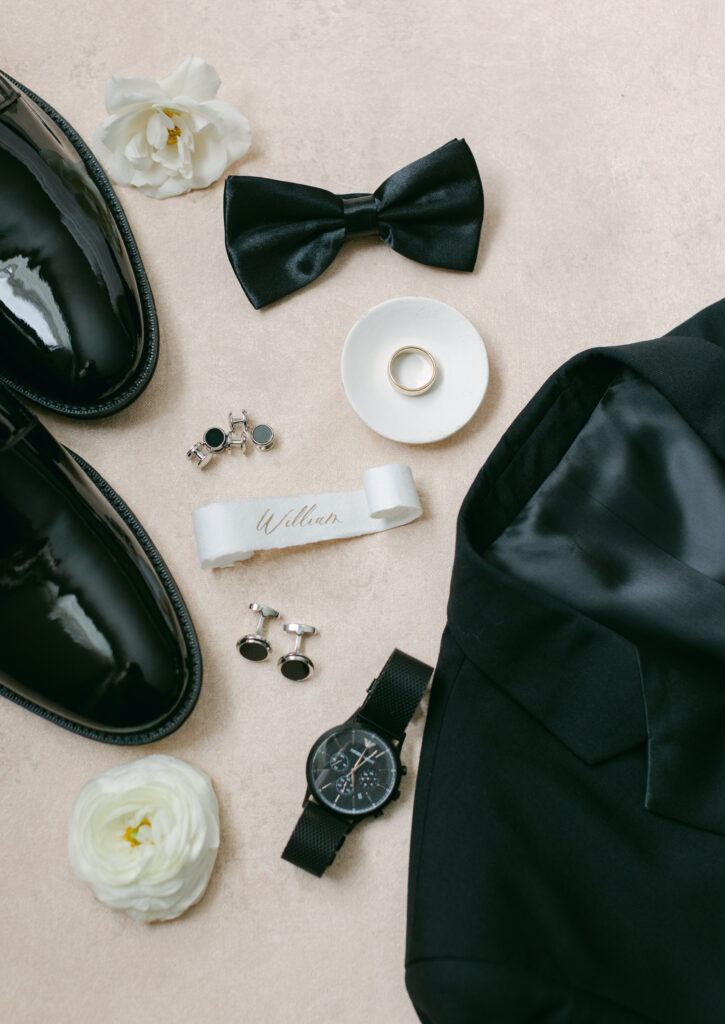 Groom details. Jacket, shoes, bowtie and ring. 