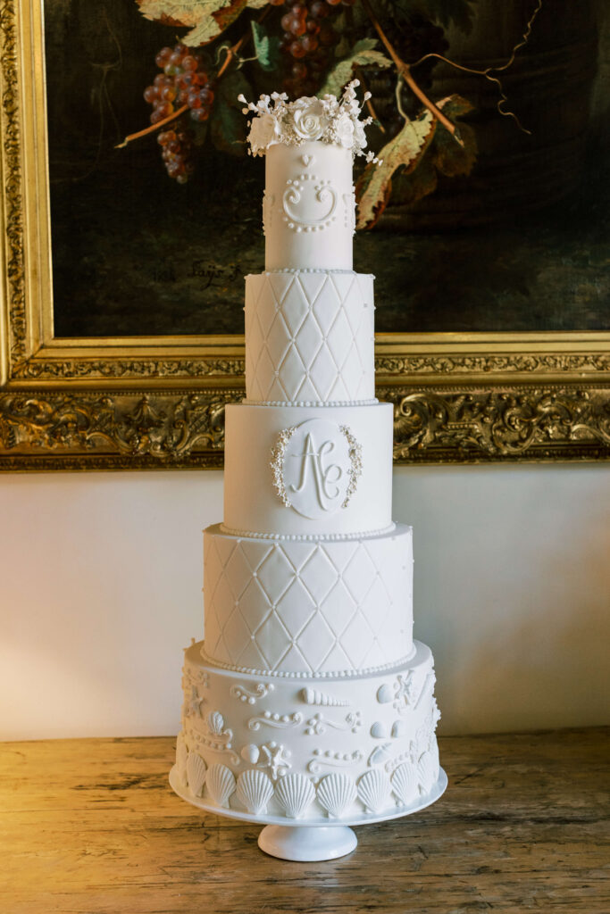 A towering white wedding cake. 