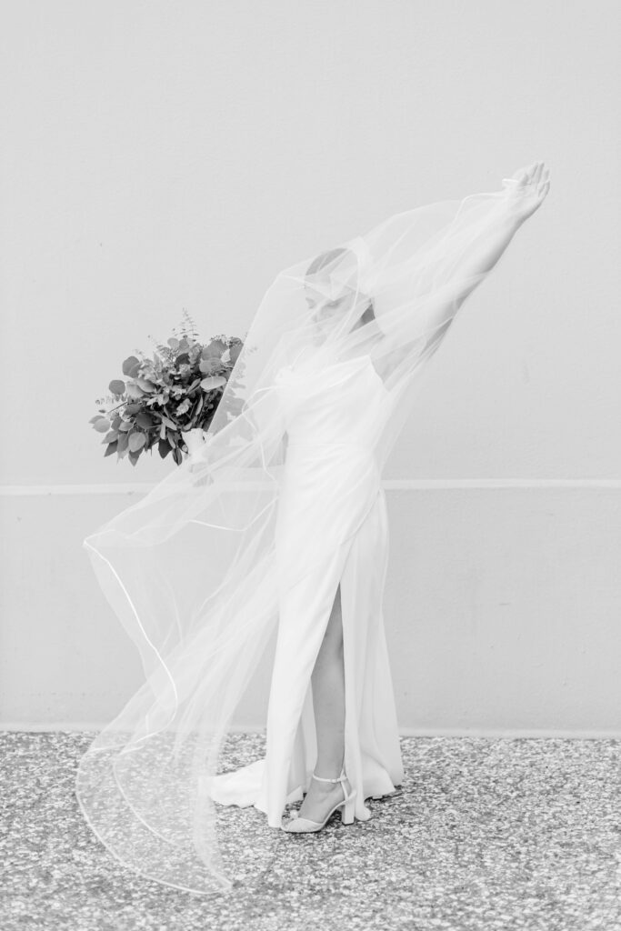 A bride waves her veil. 