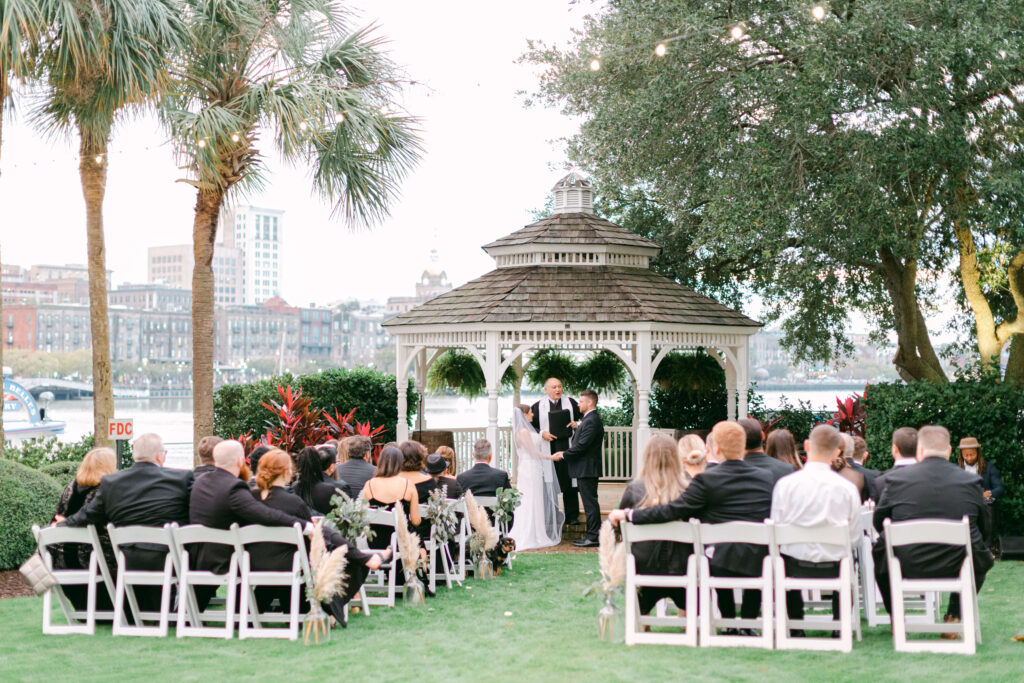 A bride and groom stand at the alter at Westin Savannah. 