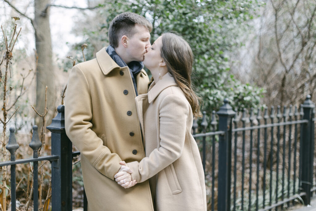 A couple kisses for their NYC Engagement Photos